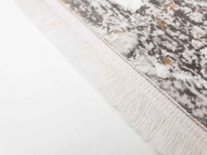 Wykończenie frędzlami dywanu Exclusive 101 beżowo-złotego