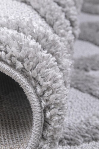Zbliżenie na runo cut_loop i obszycie dywanu Berber 6843 grey
