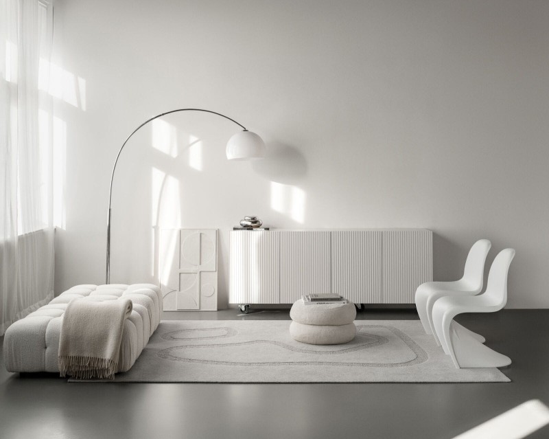 Dywan wełniany jasny szary Agnella Ladnini Morphic Blooms w salonie