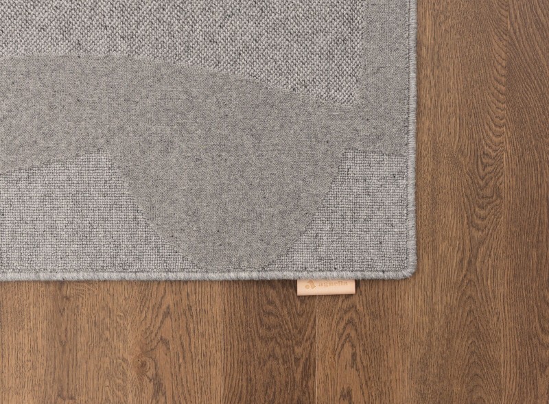 Dywan wełniany Agnella Ladnini Morphic Botanica szary - róg dywanu