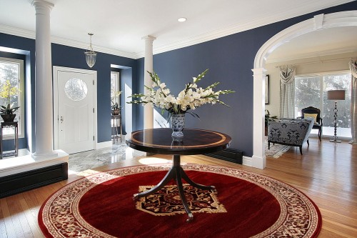 dywan okrągły wełniany tradycyjny Agnella Isfahan Uriasz rubin w salonie