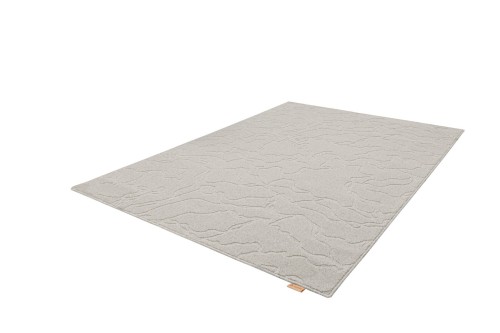 Rzut z boku dywanu wełnianego Agnella Noble Tarion jasny szary