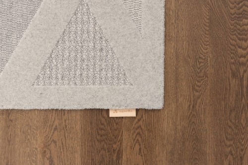 Dywan Art Deco wełniany Agnella Noble Elois szary - zdjęcie brzegu dywanu