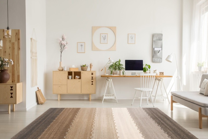 Dywan wełniany Agnella Tempo Natural Passion beżowy w salonie w stylu skandynawskim