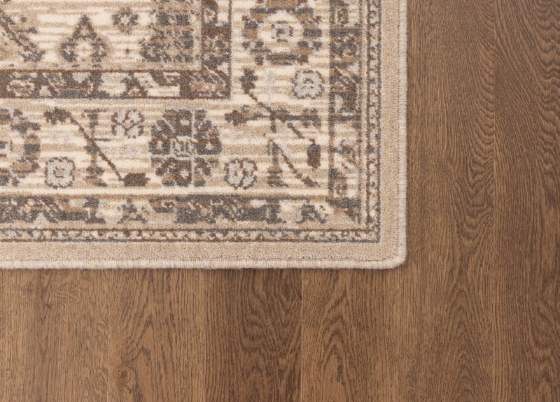 Dywan welniany na podłodze venge Agnella Ballata Emivo w kolorze beżowym