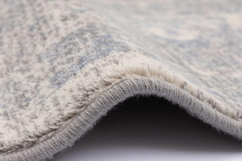 Obszycie wełniane dywanu Agnella Isfahan Pale kolor jasny niebieski