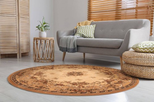 Dywan wełniany okrągły Agnella Isfahan Dafne kolor sahara rozmiar 2x2 m w salonie