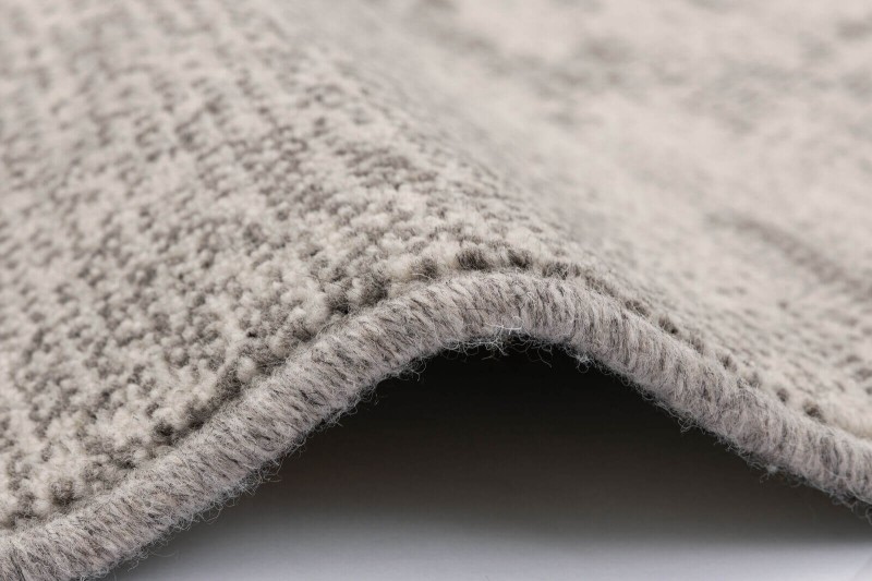 Dywan wełniany nowoczesny Agnella Ballata Jos szary - obszycie wełniane dywanu