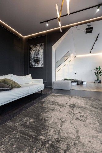 Dywan wełniany loft Agnella Ballata Sena jasny szary w salonie