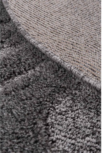 Spód ciemno szarego dywanu okrągłego shaggy Pisa fala