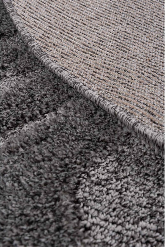 Spód ciemno szarego dywanu okrągłego shaggy Pisa fala