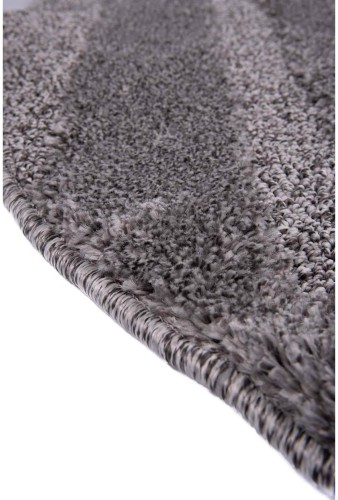Bok ciemno szarego dywanu okrągłego shaggy geometria 3d Pisa romby