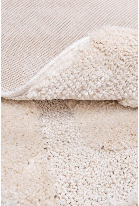 Spód kremowego dywanu okrągłego shaggy geometria 3d Pisa romby