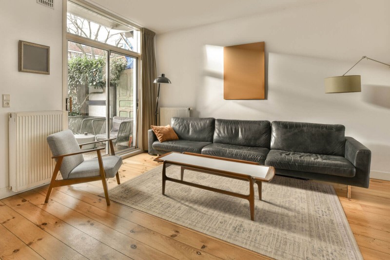 Dywan wełniany Agnella Agnus Veni krem w salonie