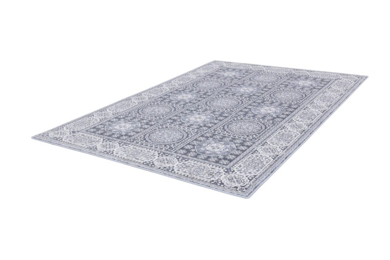 Dywan wełniany Agnella Isfahan Nour jasny niebieski - zdjęcie dywanu pod kątem