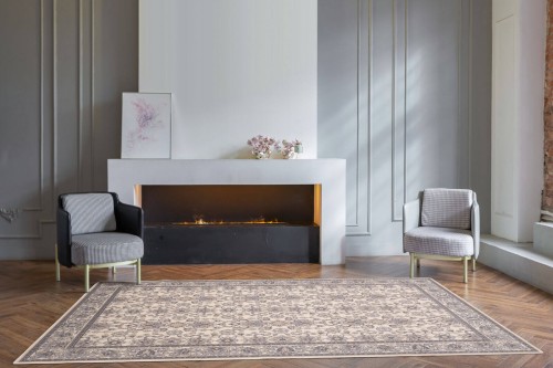 Dywan wełniany klasyczny Agnella Isfahan Kantabria kolor alabastrowy w salonie w stylu glamour z kominkiem