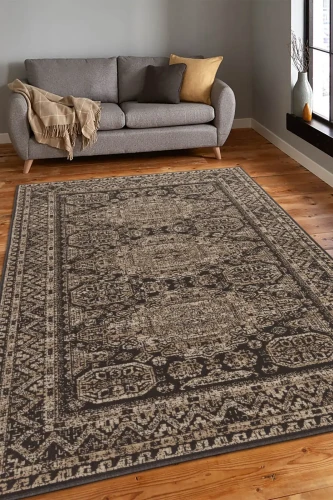 Dywan wełniany Agnella Ballata Aneko kolor brązowy w salonie na podłodze drewnianej