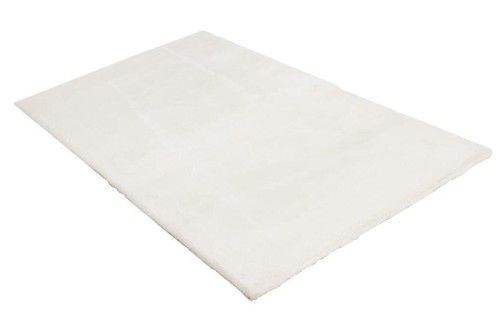 Rzut z boku na kremowy dywan pluszowy Obsession Milestone MST 600