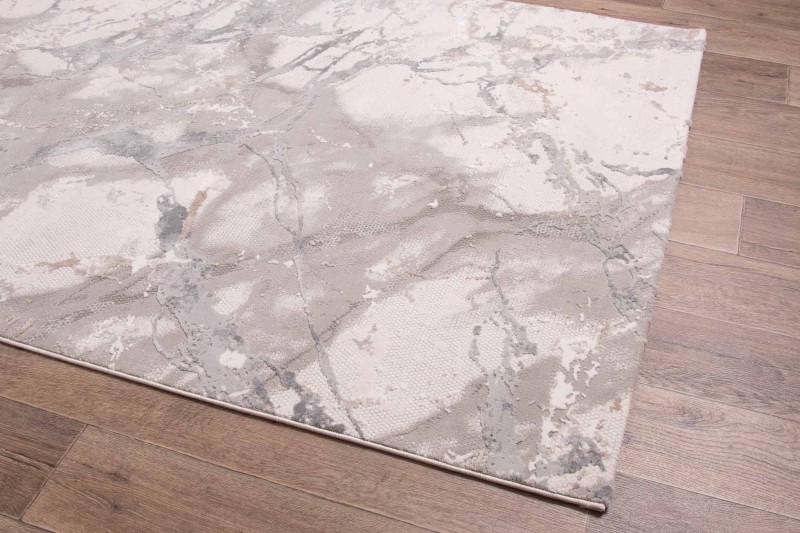 Rzut z boku na beżowo-szary dywan nowoczesny Dywilan Lila 1 D841B