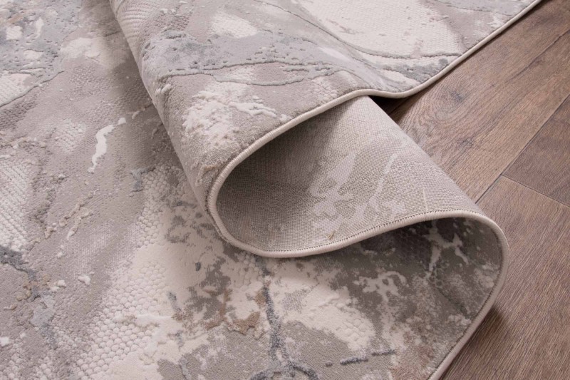 Spód beżowo-szarego dywanu nowoczesnego Dywilan Lila 1 D841B