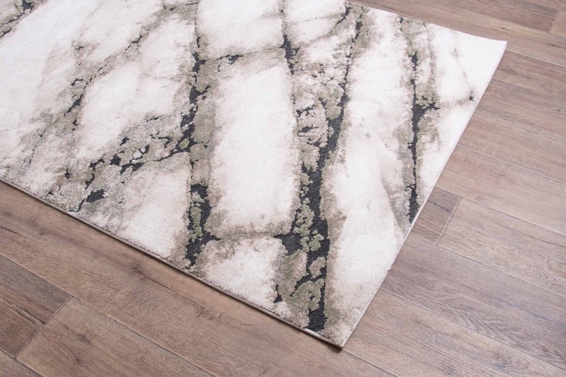 Na podłodze dywan nowoczesny Dywilan Nero 1/A2787A zielono-kremowy