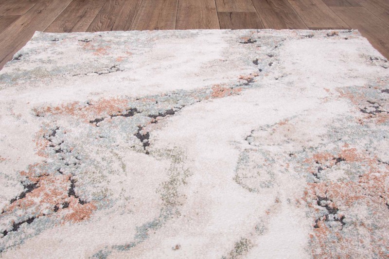 Rzut z góry na dywan nowoczesny Dywilan Nero 5/A2967A pomarańczowo-kremowy