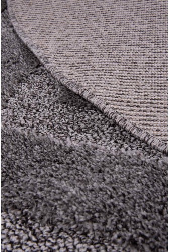 Spód ciemno szarego dywanu okrągłego shaggy geometria 3d Pisa romby