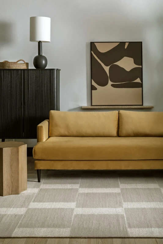 Sofa na dywanie wełnianym Agnella Agnus Pavement szary (binding)