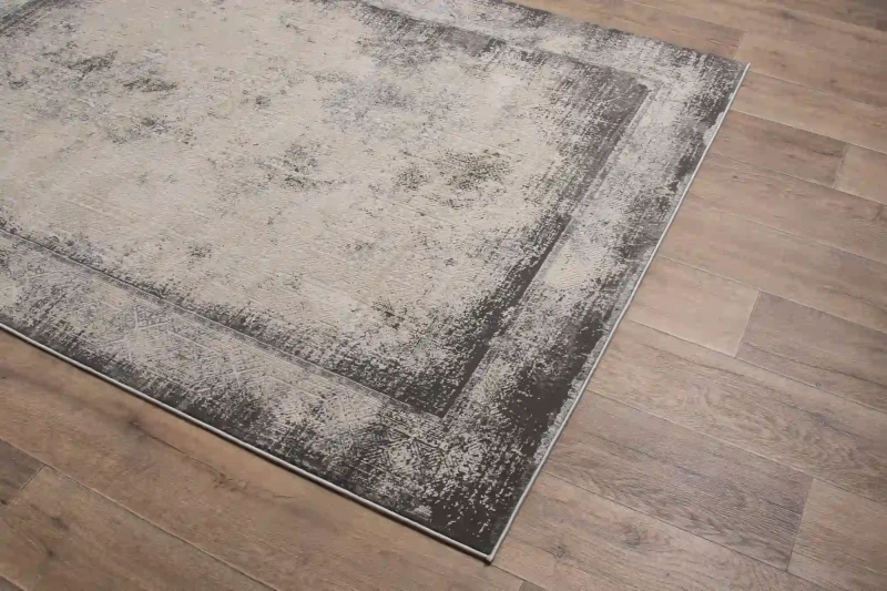 Na ciemnej podłodze dywan vintage Deluxe 9090 grey