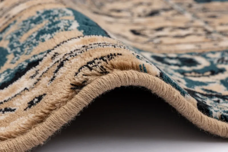 Brzeg dywanu wełnianego tradycyjnego Agnella Isfahan Rubio szmaragd