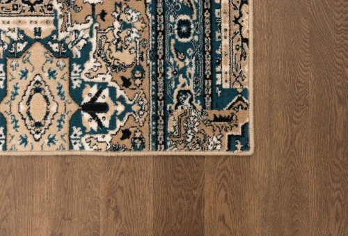 Boki dywanu wełnianego tradycyjnego Agnella Isfahan Rubio szmaragd