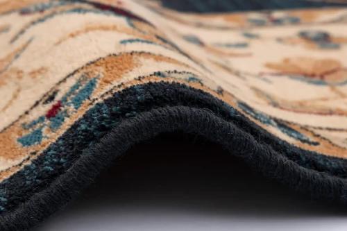 Brzeg dywanu wełnianego tradycyjnego Agnella Isfahan Nereo granatowego