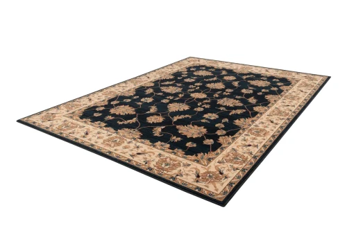 Rzut z boku na dywan wełniany tradycyjny Agnella Isfahan Nereo granatowy