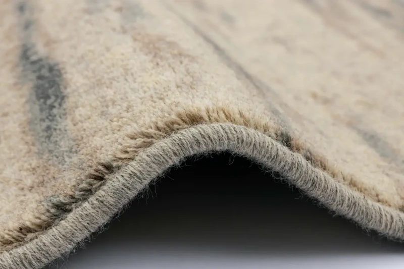 Bok dywanu wełnianego Agnella Isfahan Rigo len