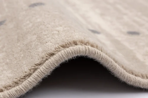 Bok dywanu wełnianego Agnella Isfahan Sabio beżowego