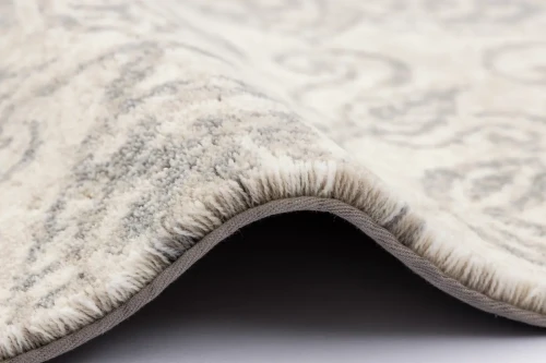 Bok dywanu wełnianego Agnella Agnus Berien białego