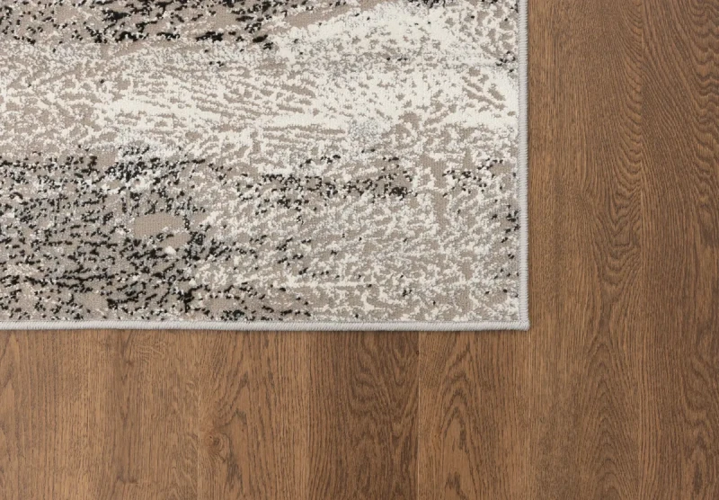 Na ciemnej podłodze dywan nowoczesny FD Lida Sund popiel