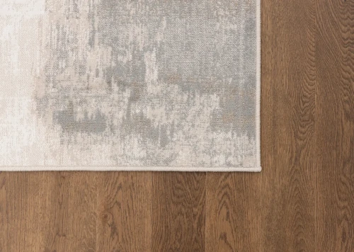 Na ciemnej podłodze dywan nowoczesny FD Sensi Erico jasny beż