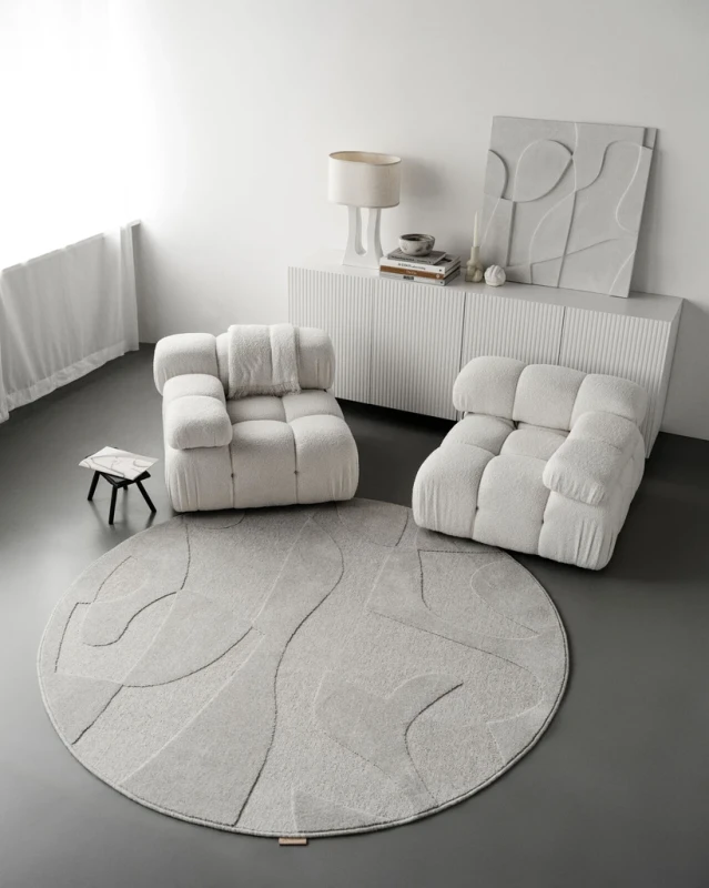 Dywan okrągły wełniany Agnella Ladnini Morphic Botanica jasny szary w salonie