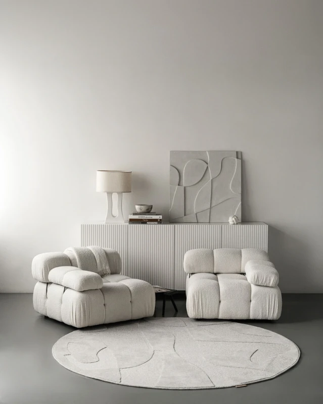 Dywan okrągły wełniany Agnella Ladnini Morphic Botanica jasny szary przy fotelach