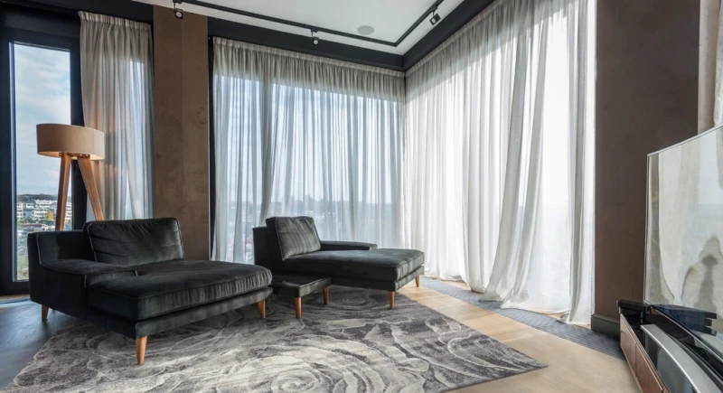 Dywan wełniany Agnella Calisia M Ros antracyt (BINDING) w salonie