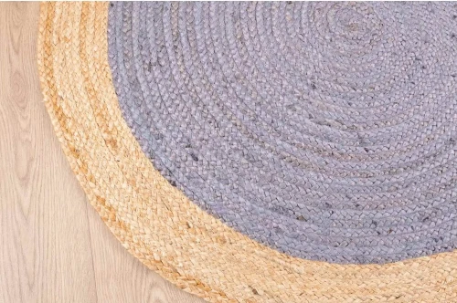 Bok dywanu okrągłego z juty bordiura szaro-beżowego