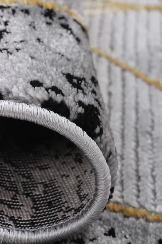 Dywan geometryczny Diamond K4498G szaro-złoty brzeg w przybliżeniu