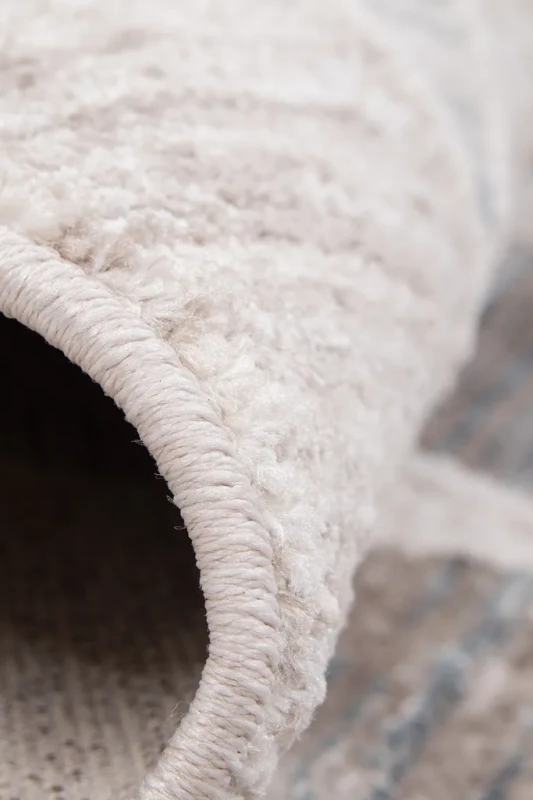 Dywan nowoczesny Camilla Santana Hamada 1875 turkus-beż brzeg z bliska