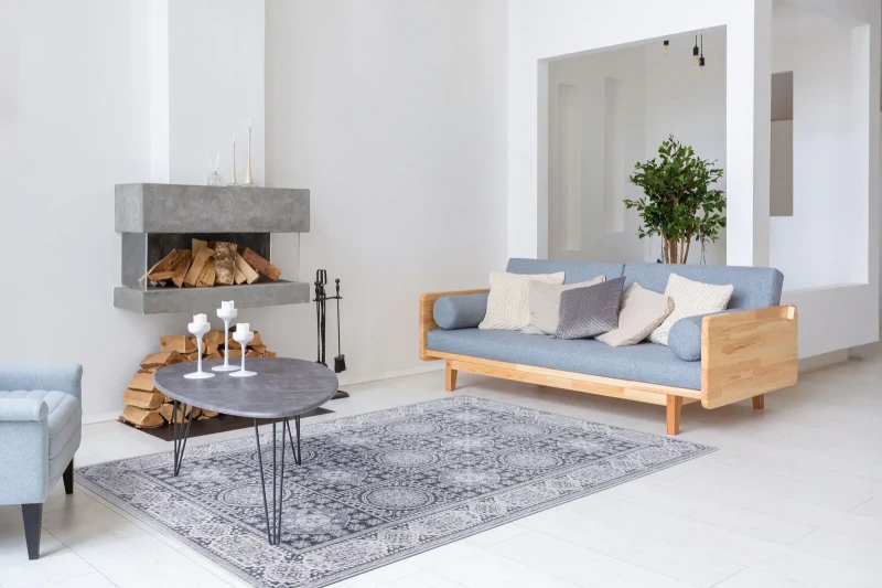 Dywan wełniany Agnella Isfahan Nour jasny niebieski w pokoju dziennym