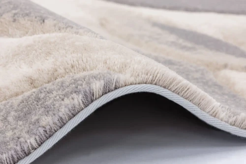 Dywan wełniany Agnella Opal Flowers beżowy - zakończenie dywanu taśmą (biding)