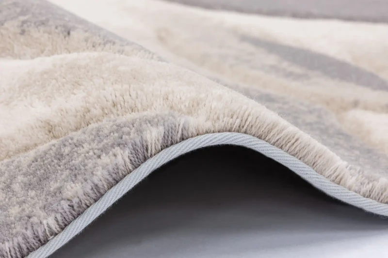 Dywan wełniany Agnella Opal Flowers beżowy - zakończenie dywanu taśmą (biding)