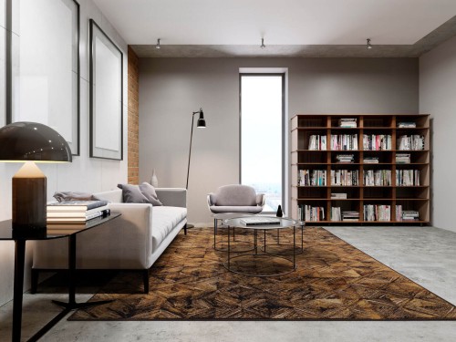 Dywan wełniany geometryczny Agnella Isfahan Estera w kolorze sahara w nowoczesnym salonie z jasnoszarą kanapą i regałem z książkami