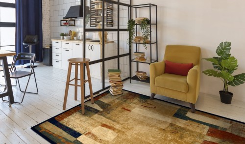 dywan wełniany Dywilan Omega Kioto kolor czerwony w pokoju dziennym z aneksem kuchennym