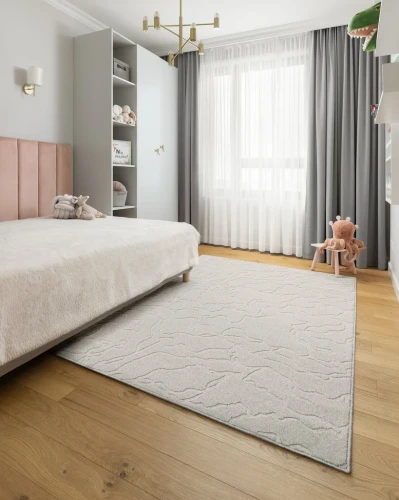Dywan wełniany Agnella Noble Tarion jasny szary w pokoju młodzieżowym
